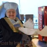 Krewe member Judy wearing a fillet hat and veil