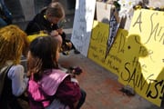 Saints rally at the Joan statue