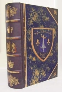 Small box in blue and gold, colored krewe crest with metallic gold and silver accents, gray binding, $18