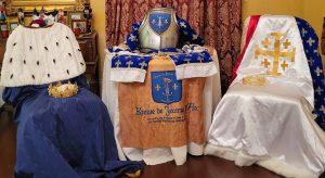 royal crowns and armor waiting to be presented to the court